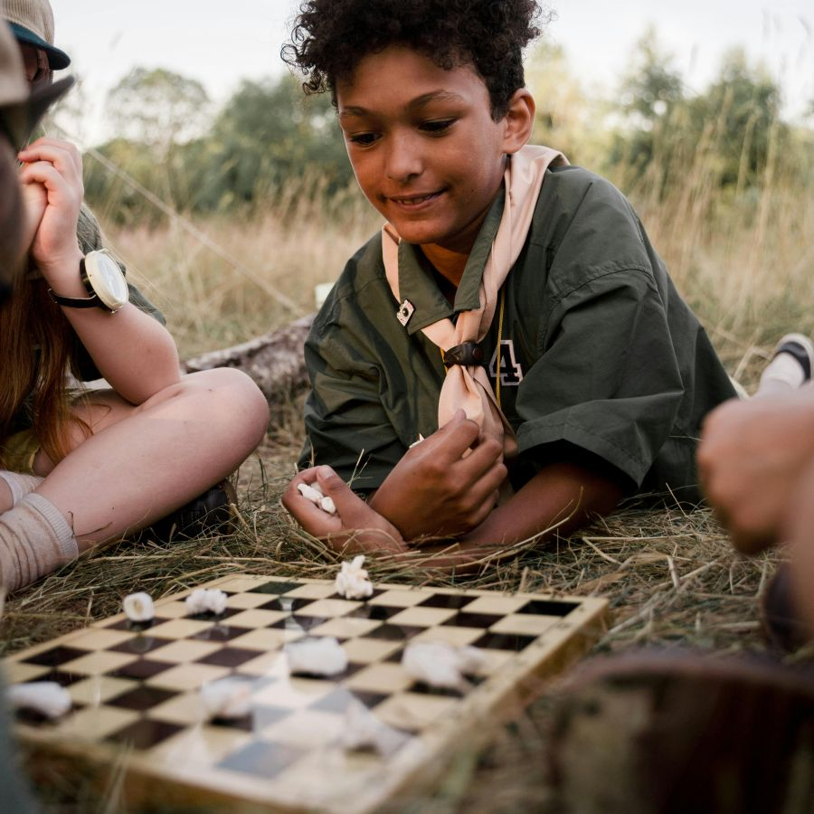 children playing chess in the park. Image by Cottonbro, Pexels.