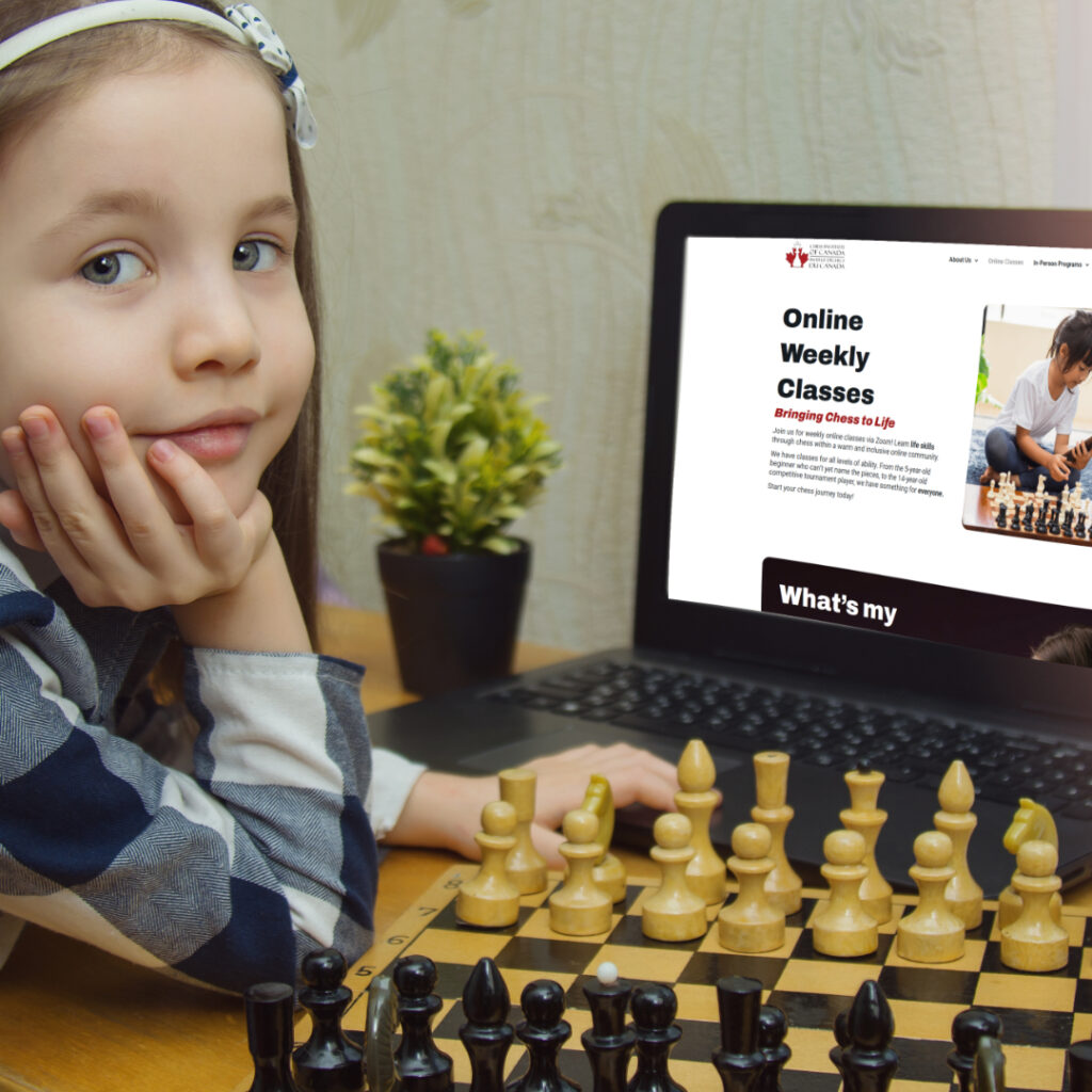 Child learning chess on computer