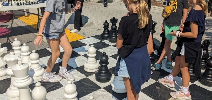 Kids playing giant chess outdoors. Credit: Heidi Gay